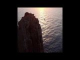 Daredevil Walks on Line High Above Spectacular Tasmanian Cliffs