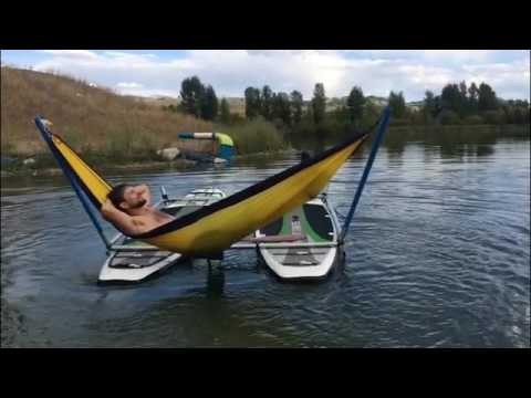 Man Chills Out on Hammock in the Middle of Peaceful Lake