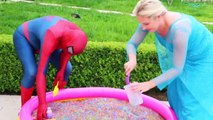 Frozen Elsa & Spiderman Buried Head in Orbeez sand surprise vs Joker Pranks Fun Superhero Real Life--Nw