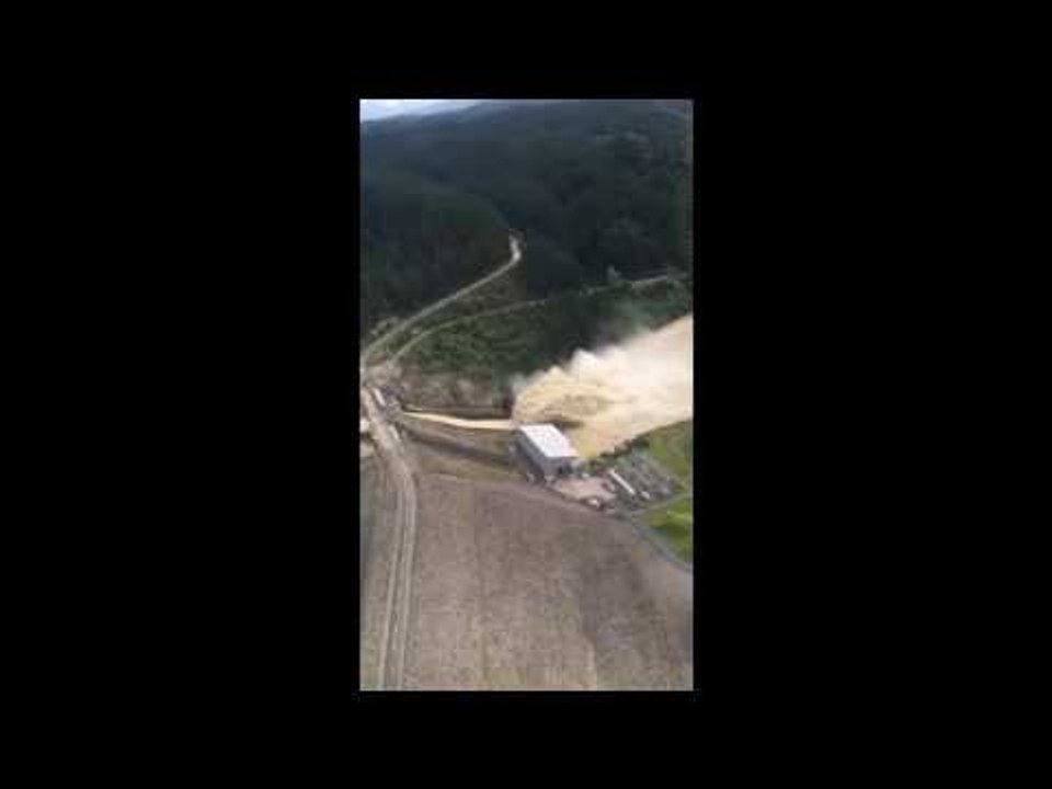 Floodwater Cascades From Dam Upstream From Inundated New Zealand Town