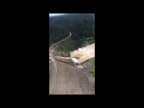 Floodwater Cascades From Dam Upstream From Inundated New Zealand Town