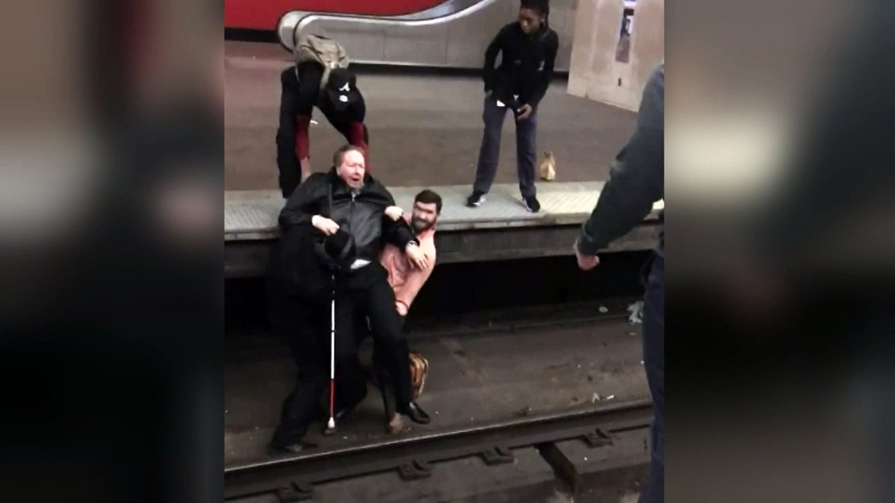 Visually impaired man saved after falling onto train tracks