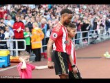 Cancer patient Bradley Lowery holds Jermain Defoe's hand