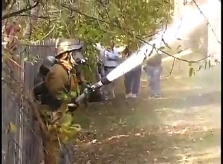 A firefighter trying to extinguish a fire