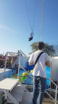 Woman Falls from Ride and Dangles by Feet