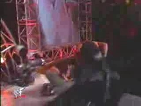 Undertaker tosses Lita off Stage