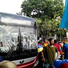 Protesters in Barinas March Past Bus Emblazoned with Anti-Maduro Graffiti