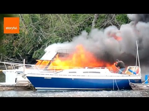 Firefighters Rescue People in Boat Fire