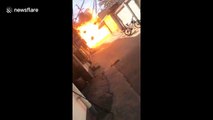 Flaming car ignites gas cylinders causing huge explosion