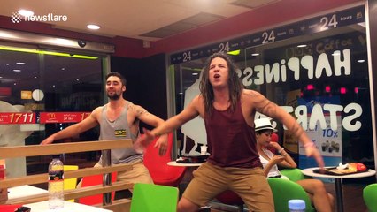 Two New Zealanders perform an impromptu Haka in a Bangkok McDonald's