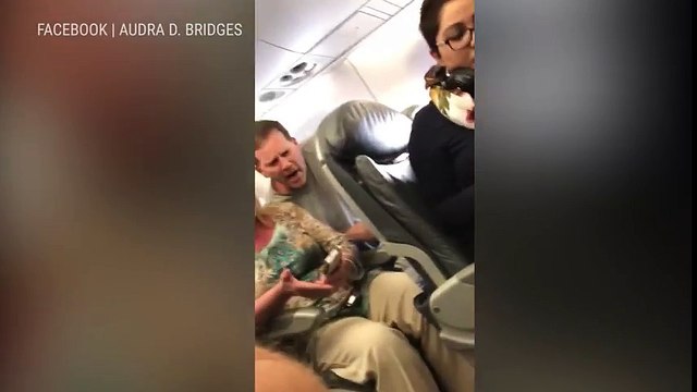 UPDATE: COP PUT ON LEAVE – United Airlines DRAGS man off plane because they OVERBOOKED flight