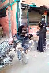 Girl Beating Boy With Helmet For Teasing Her