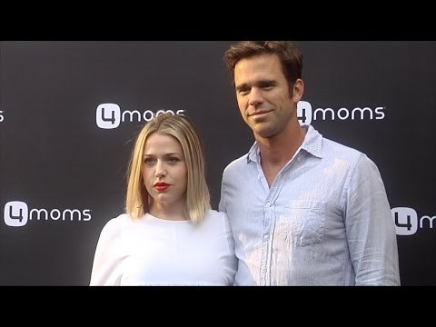 Majandra Delfino & David Walton 4moms Self-Installing Car Seat Launch Black Carpet