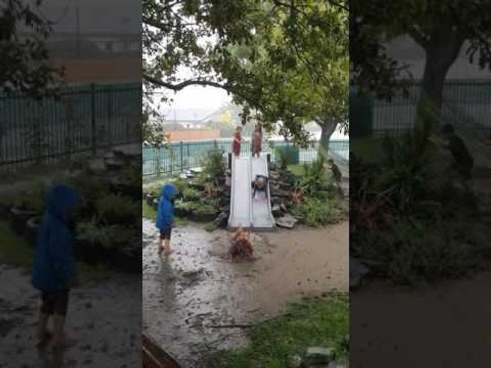 Children Play in Mud Puddles as Severe Weather Lashes New Zealand