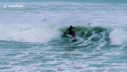 Surfers ride huge waves off New Zealand as Cyclone Cook hits