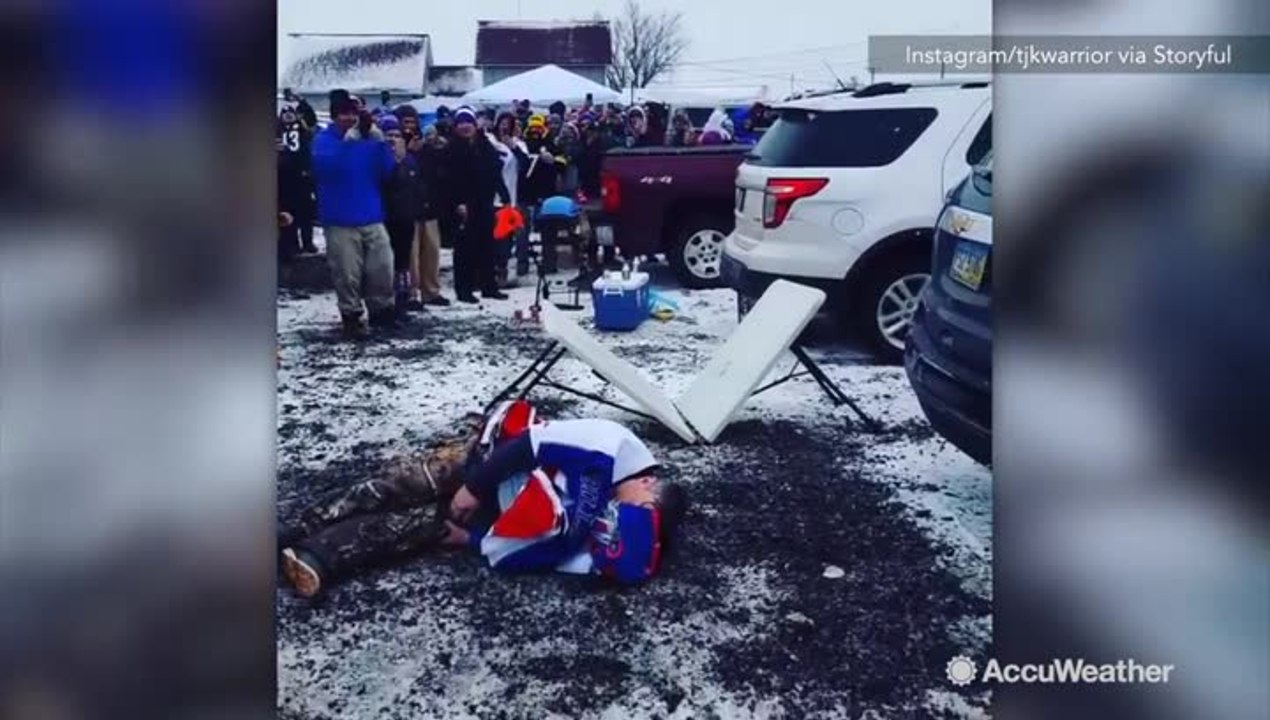 Football fan leaps from snowy car onto table, snaps leg