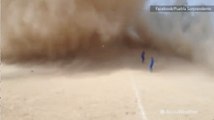 Huge dust devil interrupts soccer game in Mexico