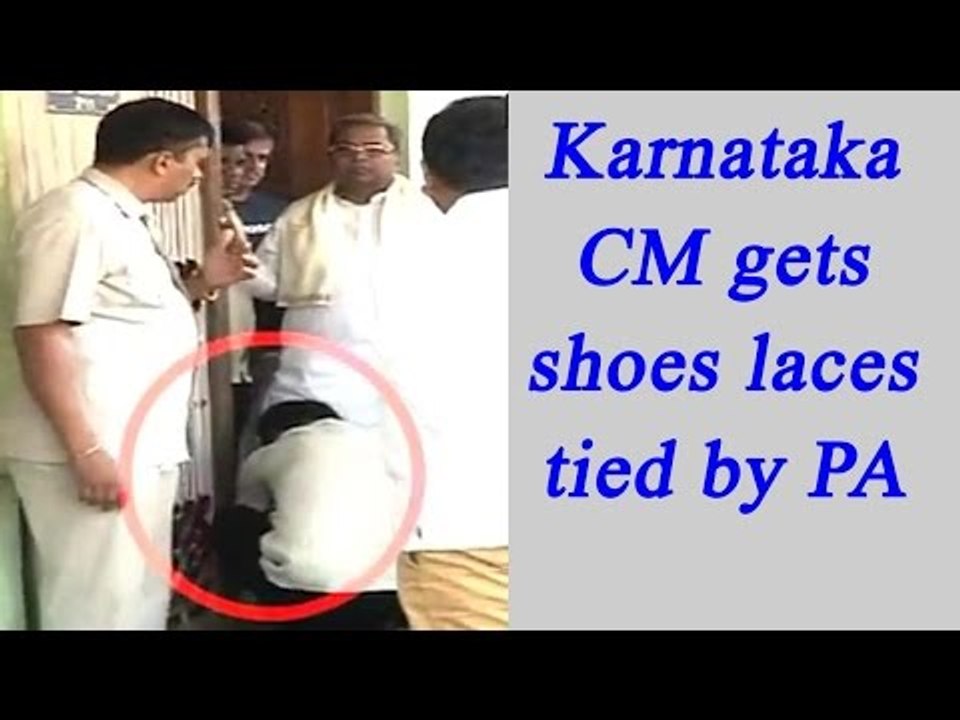 Karnataka CM Siddaramaiah caught on camera getting his shoe laces tied by his PA| Oneindia news