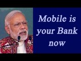 PM Modi in Deesa : Bank is now in your Mobile phone, Watch Video | Oneindia News