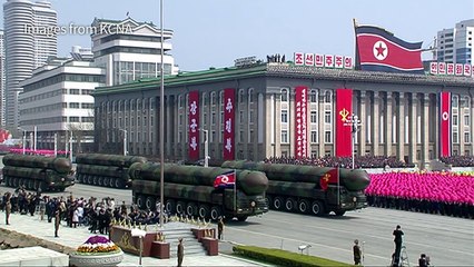 North Korea's Kim oversees parade of military strength