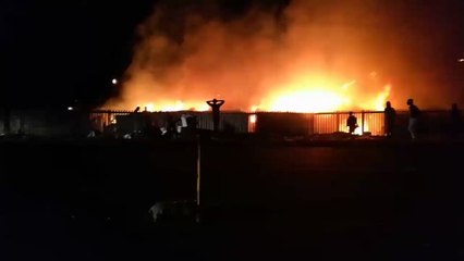 Fire Spreads Through Makeshift Homes Next to Cape Town Airport