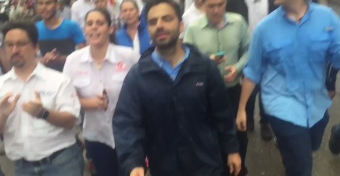 Hundreds of Demonstrators March Through Rain in Caracas