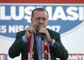 Turkey’s Erdogan declares victory in close vote to expand his powers