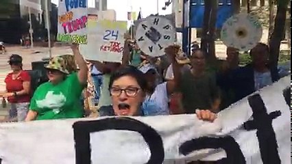 Demonstrators march through downtown Houston