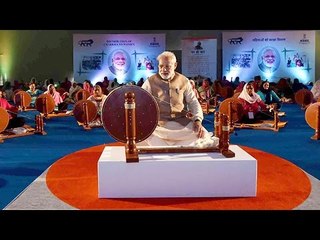 PM Modi spins charkhas with women weaves in Ludhiana, Watch Video | Oneindia News