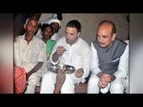 Rahul Gandhi enjoys food at Dalit's home in UP, who took loan for feeding him | Oneindia News
