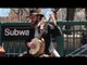 Busking Banjo Players Entertain Passersby Near New York Subway