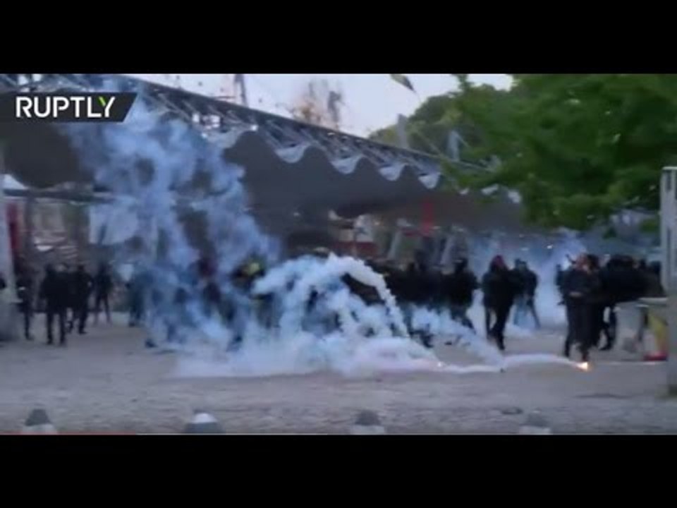 Tear gas & smoke grenades as police face off with protesters ahead of Le Pen rally