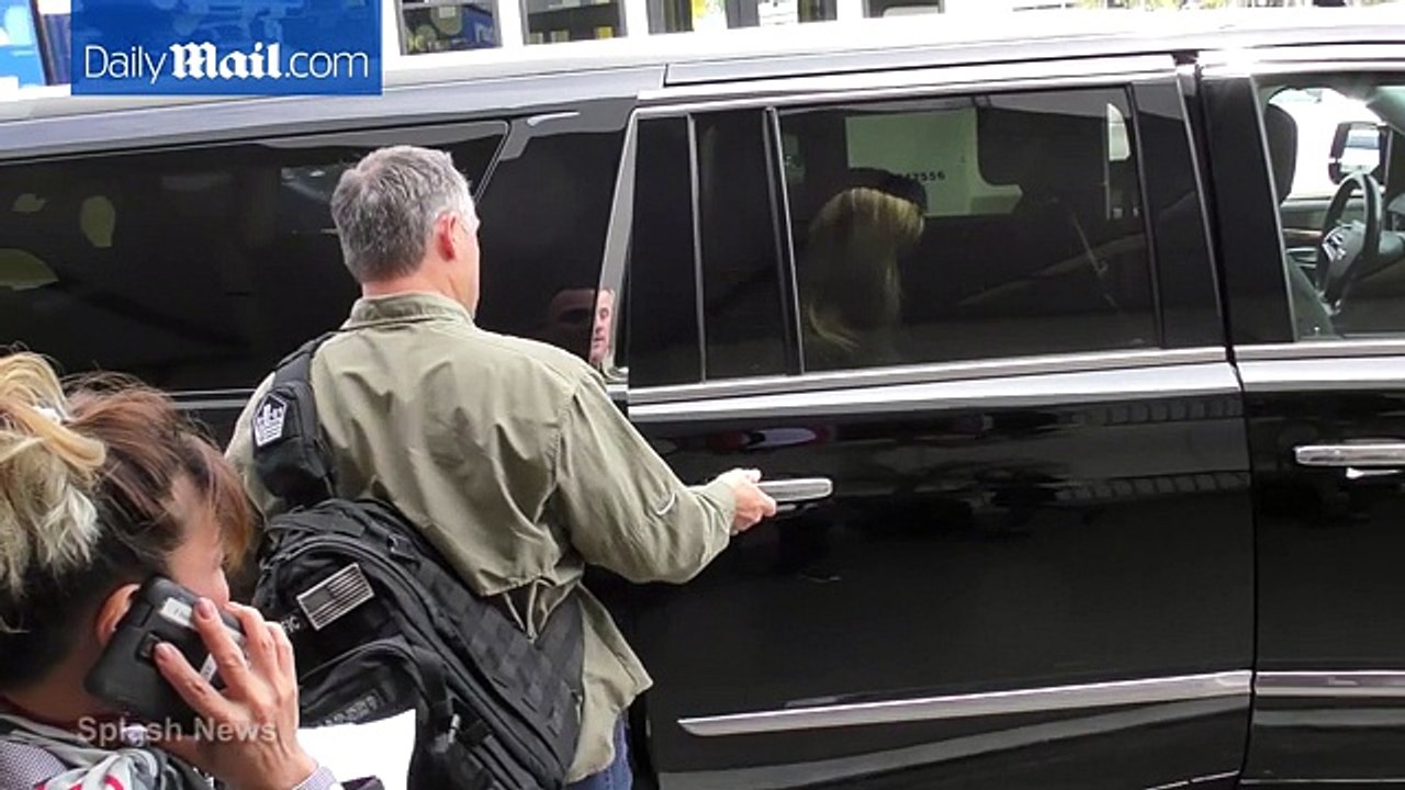 Reese Witherspoon arrives at LAX in chic black sweater -