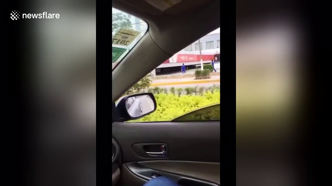 Petrol station collapses in strong wind