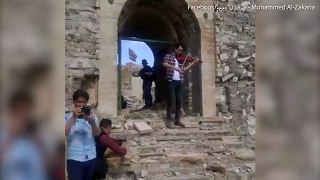 Emotional moment violinist plays in shrine recaptured by Iraqis - Daily Mail Online[via torchbrowser.com]