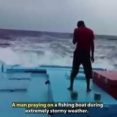 Look at This Man Praying on his Small Boat During Stormy Weather