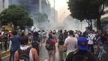 Protesters Sing As Smoke Fills Caracas Streets