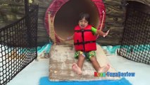 Kid playing at the WaterPark Splash Pad for children! Family Fun playtime in the Pool