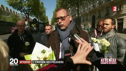Les collègues et des anonymes rendent hommage au policier tué sur les Champs-Elysées