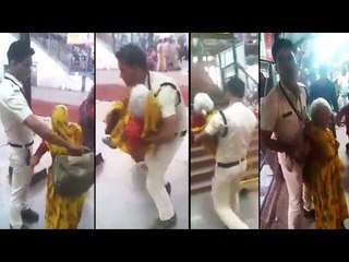 Ujjain Policeman holds woman in his arms at railway station, Watch video | Oneindia News