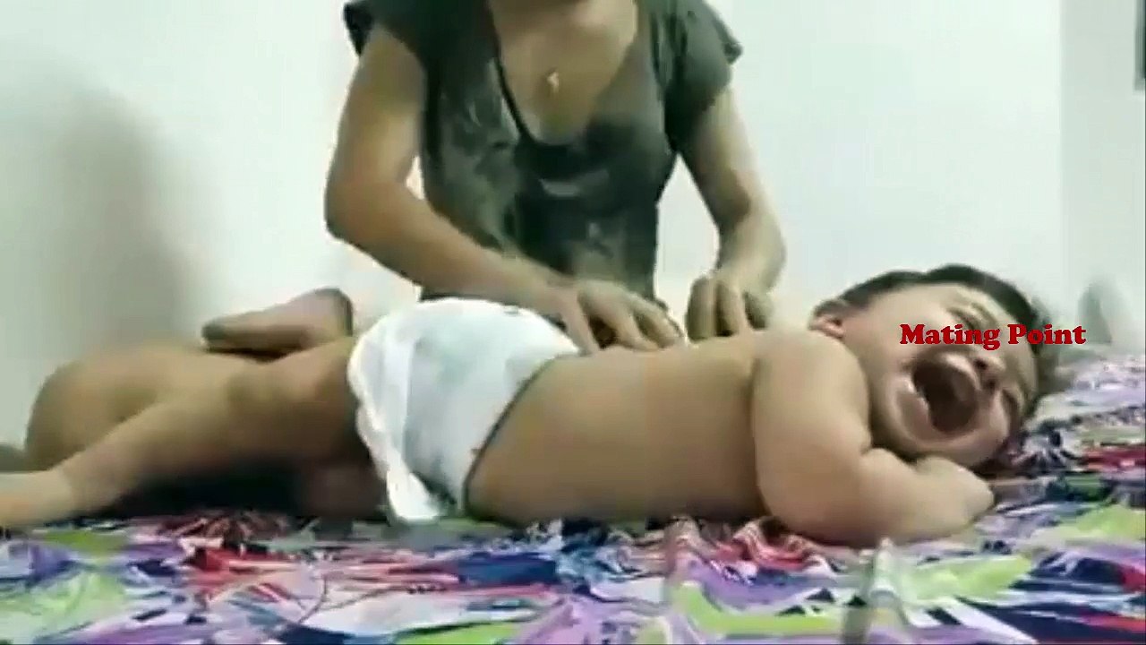 Little Cute Baby Enjoying Massage by Mom ... Very Cute!!!!!