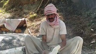 A man making very big Bread in pakistan