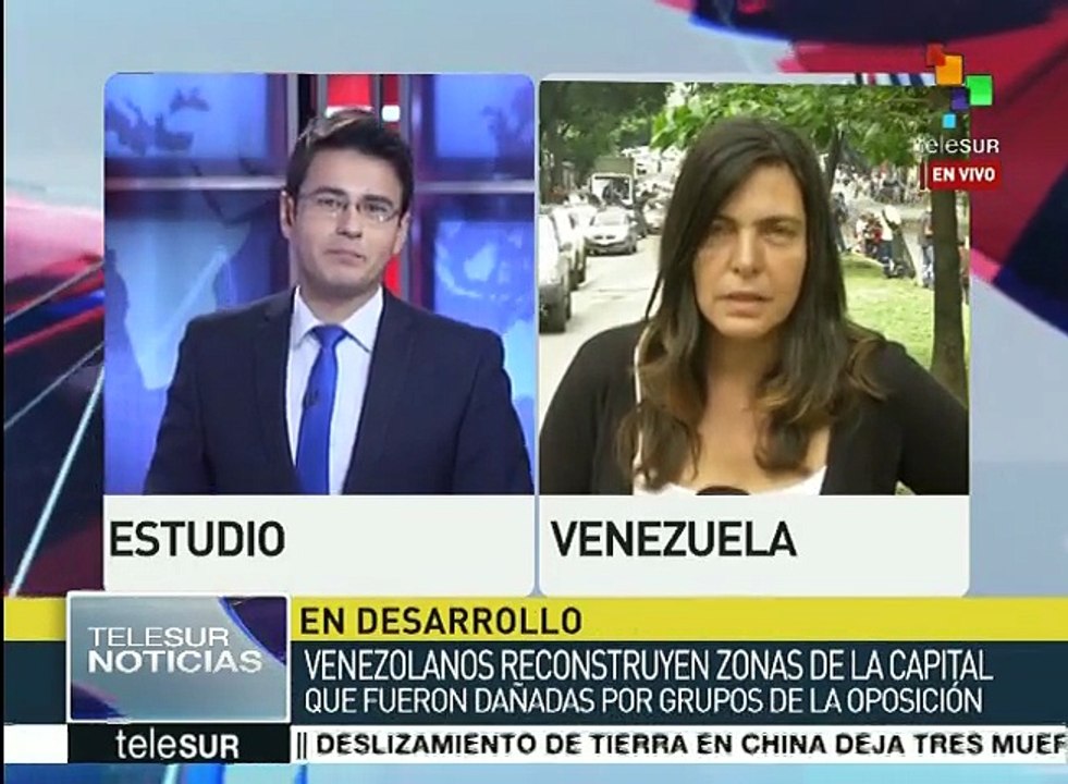 Venezolanos reconstruyen edificios vandalizados por opositores