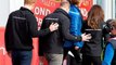Prince Harry hugs London marathon runners