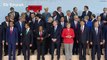 Emmanuel Macron jostles his way to the front of G20 photo to stand by Donald Trump