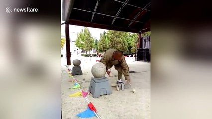 Kung-fu monk breaks stone with his hand