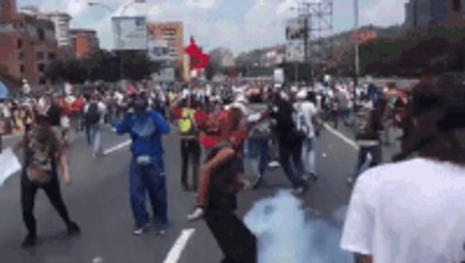 Download Video: Protesters Toss Away Tear Gas Canisters Thrown by Venezuelan Police