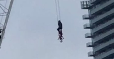 Firefighter Rescues Woman From Crane in Toronto