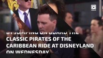 Johnny Depp climbs aboard the Pirates of the Caribbean ride at Disneyland