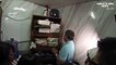 Prisoners are found crammed into a tiny dark 'secret cell' behind a bookcase in a Philippine police station